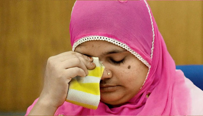 Bilkis Bano reacts during a press conference in New Delhi on May 8, 2017. — AFP