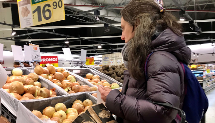 A woman buys vegetables at a supermarket in Buenos Aires, Argentina on August 31, 2018. — Reuters