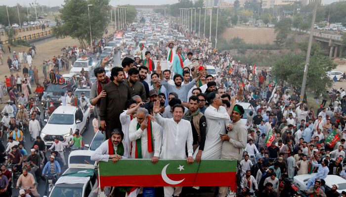 Ousted prime minister Imran Khan gestures as he travels on a vehicle to lead a protest march in Islamabad, on May 26, 2022. — Reuters