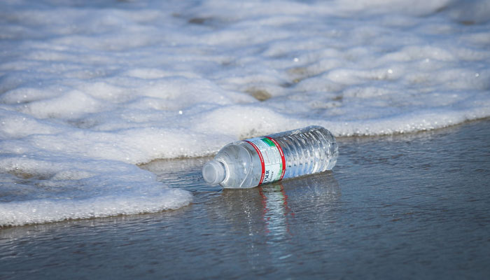 Single-use plastic water bottles arent only a waste of money, but they usually end up littering our beaches. Use less plastic when you spend time outdoors, the world will thank you. — Unsplash