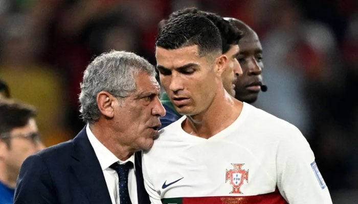 Former Portugal head coach Fernando Santos (left) and Cristiano Ronaldo. — AFP/File