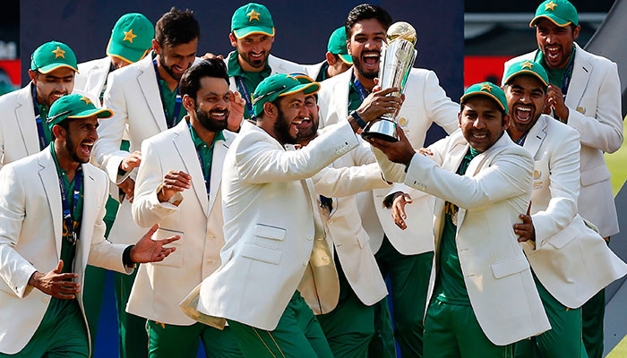 Sarfraz Ahmed (third right) lifts the trophy as Pakistan players celebrate their win at the presentation after the ICC Champions Trophy final cricket match between India and Pakistan at The Oval in London. — AFP/File
