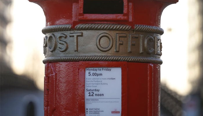An ornate red post box in Liverpool, UK.—Reuters