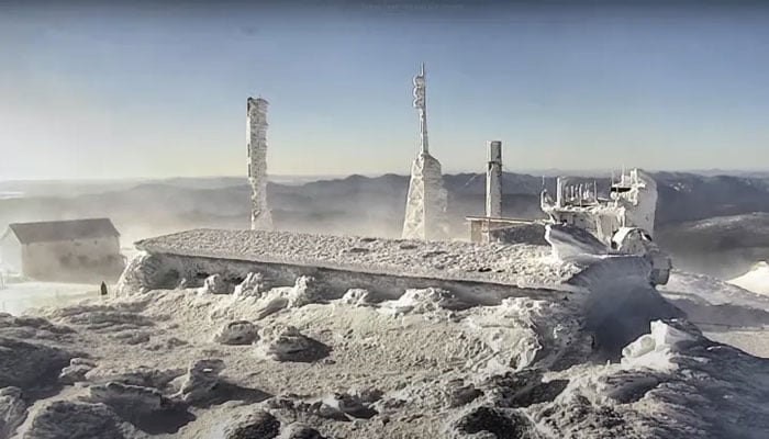 The top of the observatory tower at Mount Washington State Park, where the wind chill dropped to -79 Celsius, is seen in a still image from a live camera in New Hampshire, US, February 4, 2023 [Mount Washington Observatory/mountwashington.org/Handout via Reuters]