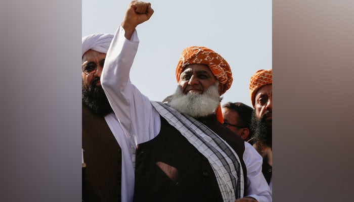 Jamiat Ulema-e-Islam- Fazl chief Maulana Fazlur Rahman raises his fist during a public gathering in this undated picture. — Reuters/File