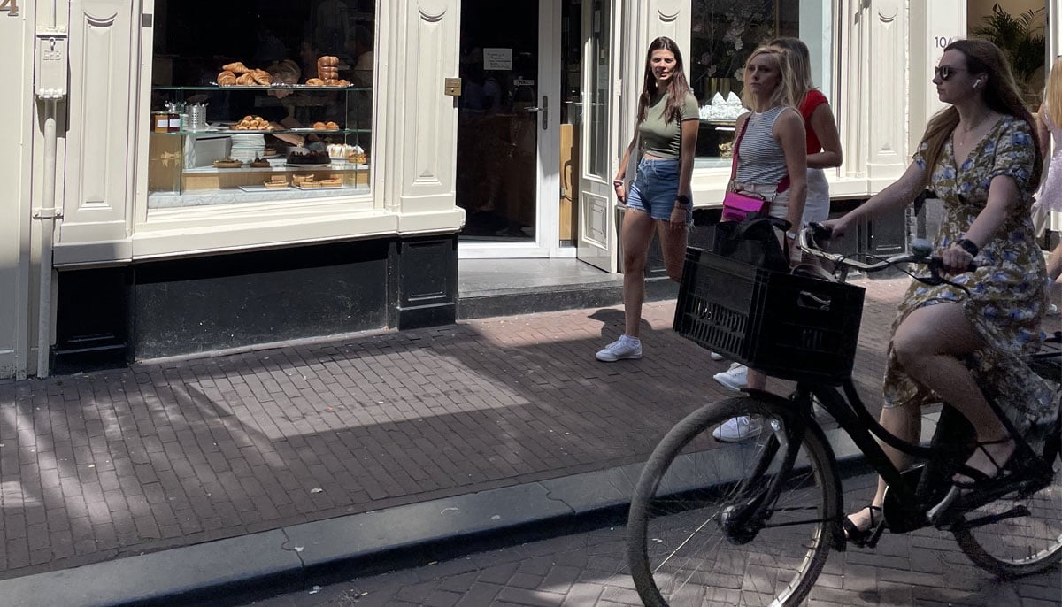 Women cycling in the streets of Amsterdam, The Netherlands in 2023. — Photo by author