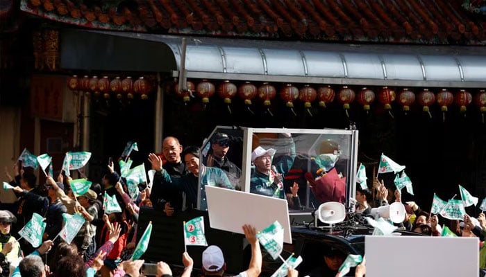 Lai Ching-te, Taiwans vice president and the ruling Democratic Progressive Partys (DPP) presidential candidate, waves to supporters while riding in the back of a vehicle during a campaign event ahead of the elections in New Taipei City, Taiwan January 12, 2024. —Reuters