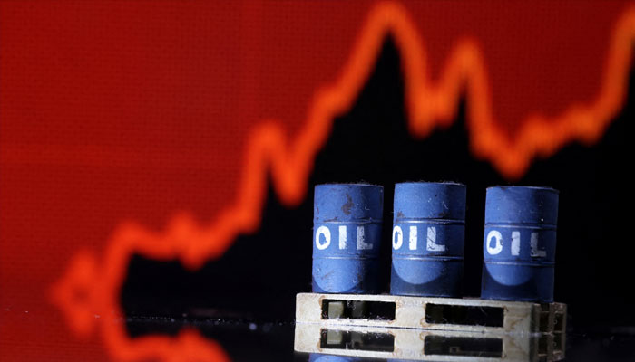 Model of Oil barrels are seen in front of rising stock graph in this illustration, July 24, 2022. —Reuters