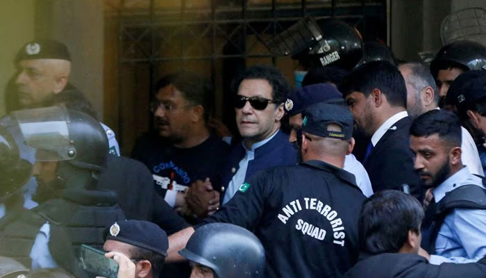 Security officers escort PTI founder Imran Khan, as he appeared in Islamabad High Court, Islamabad, Pakistan May 12, 2023. — Reuters