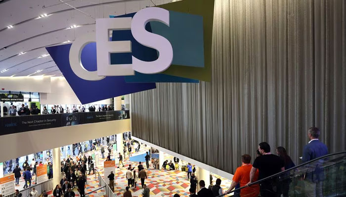 Attendees head to exhibits during CES 2024, an annual consumer electronics trade show, in Las Vegas, Nevada, U.S. January 9, 2024, — Reuters