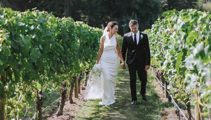Former New Zealand Prime Minister Jacinda Ardern poses with her husband Clarke Gayford after getting married on January 13, 2024. - New Zealand Herald via Felicity Jean Photography