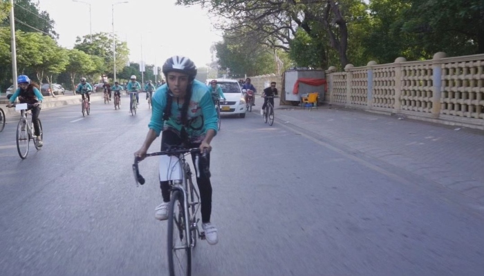 A group of girls mostly from Lyari are cycling on a Karachi artery in this undated picture. —Instagram/ lyarigirlscafe