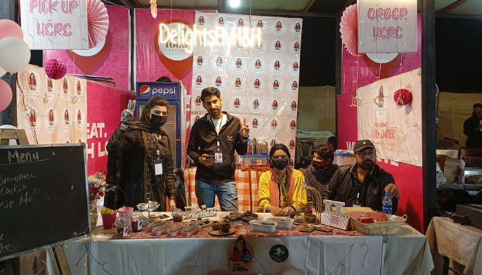 Hadiya, (left) poses with her family and friends who helped her out at the stall. — Reporter