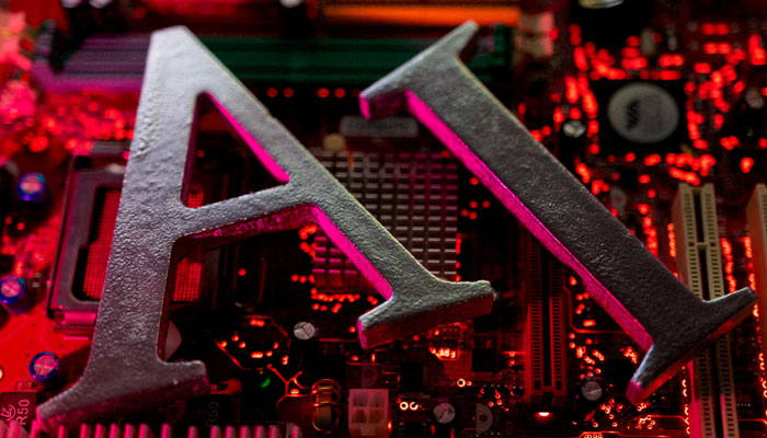 AI (Artificial Intelligence) letters are placed on computer motherboard in this illustration taken, June 23, 2023. —Reuters