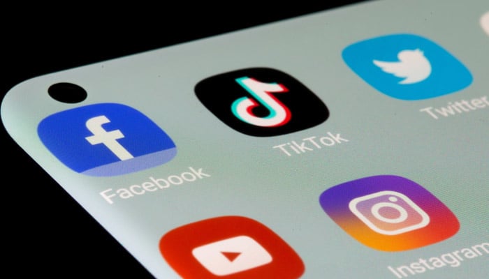 Facebook, TikTok, X, YouTube and Instagram apps are seen on a smartphone. — Reuters