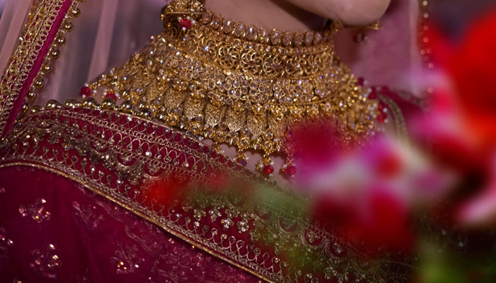 Representational image of a bride wearing jewellery. — Unsplash