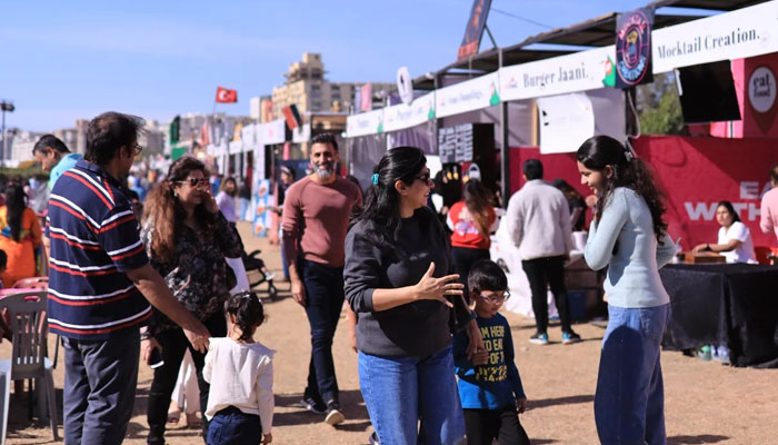 A family tours the stalls at the festival. — Facebook/Karachi Eat Festival