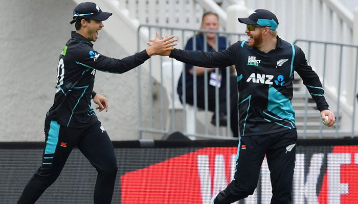 New Zealand´s Glenn Phillips and Mark Chapman celebrate the wicket of Pakistan´s Babar Azam during the third Twenty20 international cricket match between New Zealand and Pakistan University Oval in Dunedin on January 17, 2024. — AFP