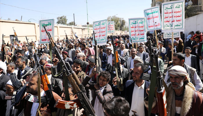 Houthi supporters hold up their weapons during a demonstration against the United States decision to designate the Houthis as a foreign terrorist organisation, in Sanaa, Yemen January 20, 2021. —Reuters