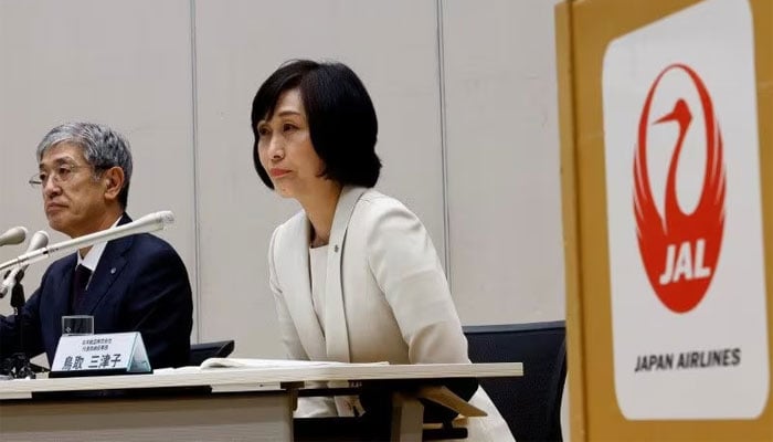 Japan Airlines current president Yuji Akasaka and new president Mitsuko Tottori attend a press conference in Tokyo, Japan on January 17, 2024. — Reuters
