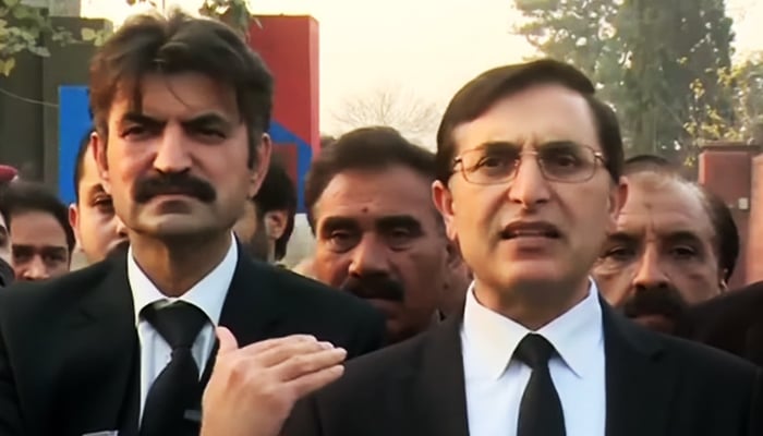 Senior PTI leader Barrister Gohar Ali Khan (right) addressing a press conference in Rawalpindi, on January 18, 2023, in this still taken from a video. — Geo News