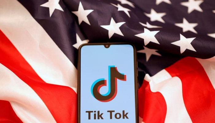A display of TikTok logo on a smartphone with a US flag as the background. — Reuters/File