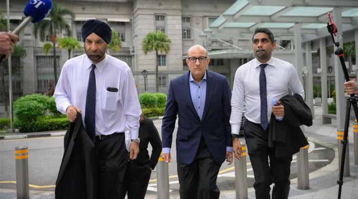 Singapore minister charged in corruption case for allegedly taking up S$160,000 ‘presents’