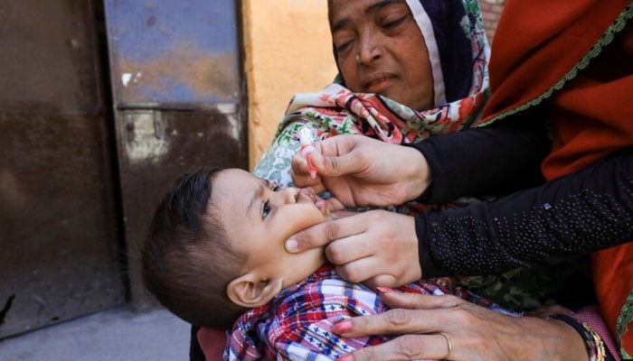 A boy receives polio vaccine drops during an anti-polio campaign in Peshawar, Pakistan, Feb. 17, 2020. — Reuters