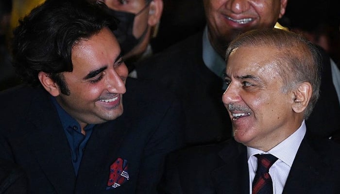 PML-N President Shahbaz Sharif (right) and PPP Chairman Bilawal Bhutto-Zardari smile during a press conference in Islamabad on April 7, 2022. — AFP