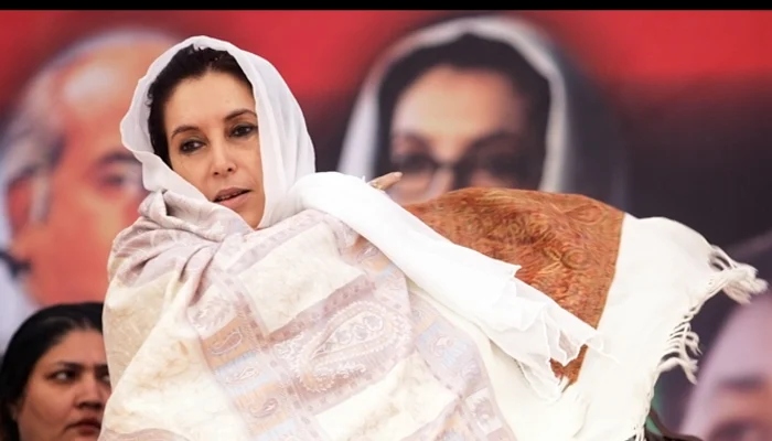 Pakistans former prime minister Benazir Bhutto arrives at an election campaign public meeting in Nowshera on December 12, 2007. — AFP