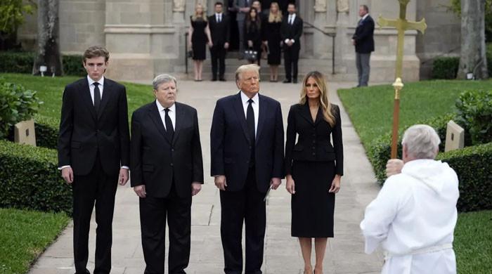 Is it really Barron Trump standing alongside Donald, Melania, Viktor Knavs?