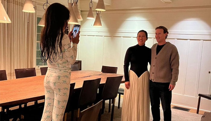 Meta CEO Mark Zuckerberg poses with his wife, Dr Priscilla Chan as his daughter Max stands on a chair to snap a photo before the couple left for a date night. — Instagram/@zuck