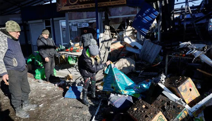 People remove debris at a food market following, what local Russian-installed authorities say, was a Ukrainian military strike in the course of the Russia-Ukraine conflict in Donetsk, Russian-controlled Ukraine, January 21, 2024. —Reuters