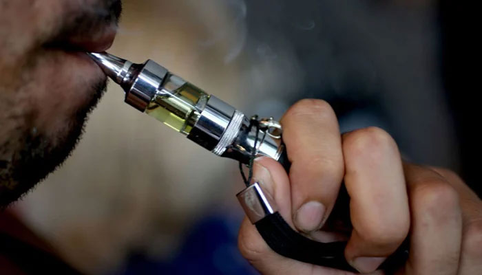 A representational image showing a person smoking an e-cigarette. — AFP/File