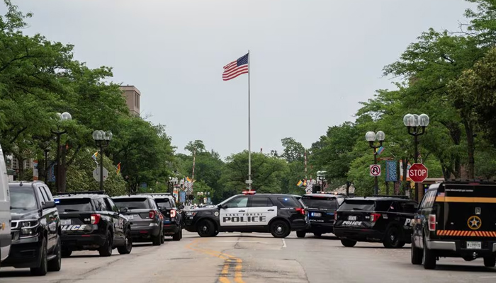 Several law enforcement departments monitor the scene of a mass shooting at a Fourth of July parade route in the wealthy Chicago suburb of Highland Park, Illinois, US. — Reuters/File