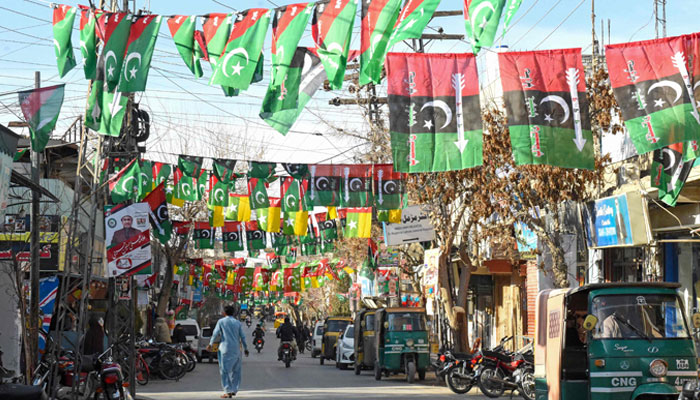A street is festooned with flags of political parties ahead of Pakistan´s national elections 2024, in Quetta on January 21, 2024. — AFP