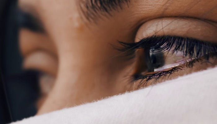 A representational image of tears welling up in a persons eyes. — Unsplash