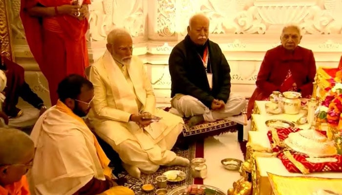 Indias Prime Minister Narendra Modi accompanied by Hindu nationalist organisation Rashtriya Swayamsevak Sangh (RSS), Mohan Bhagwat takes part in rituals during the opening of a grand temple to the Hindu god Lord Ram in Ayodhya, India, January 22, 2024. — Reuters