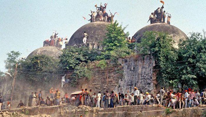 This old picture shows Hindu mobs at the Babri Masjid in Arodhya. — AFP/File