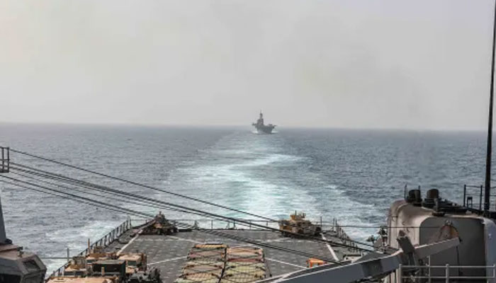 In this image provided by the US Navy, the amphibious dock landing ship USS Carter Hall and amphibious assault ship USS Bataan transit the Bab al-Mandeb strait on Aug. 9, 2023.—AFP
