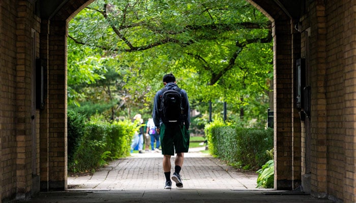 People walk on the grounds of the University of Toronto in Toronto, Ontario, Canada September 9, 2020. Picture taken September 9, 2020. —Reuters