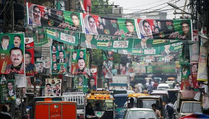 A street in Rawalpindi, Pakistan, is festooned with political parties’ banners ahead of general elections on July 25, 2018. — Reuters