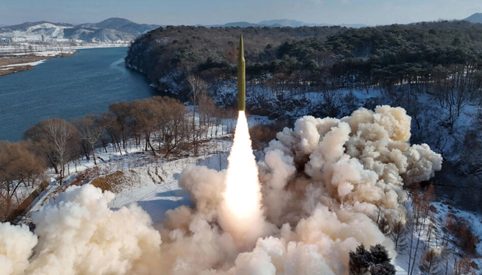 This picture taken on January 14, 2024, shows the test-firing of an intermediate-range solid-fuel ballistic missile at an unconfirmed location in North Korea. — KCNA