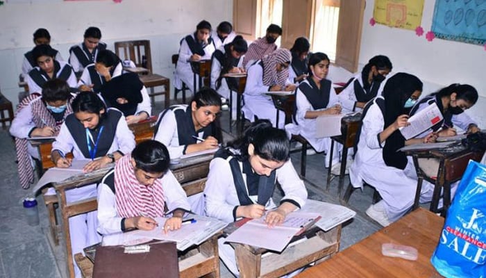 Female students are pictured during annual board exams at a government college. — APP/File