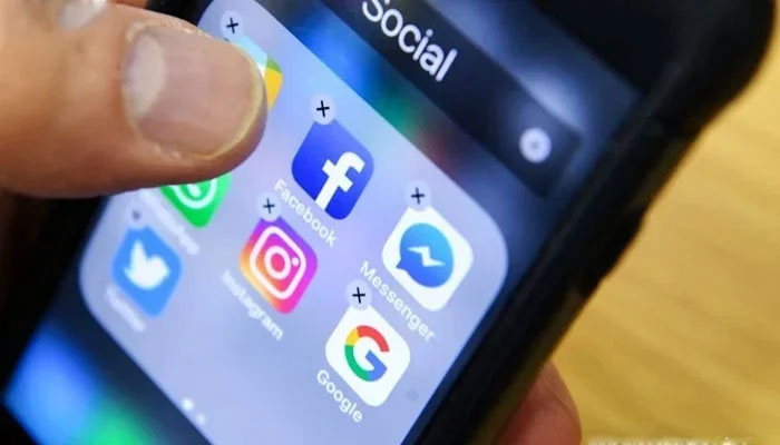 This image shows many social media apps on a phone screen. — X/AFP/File