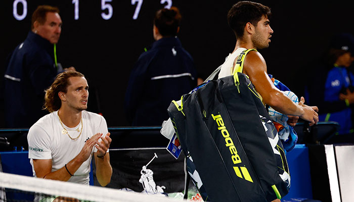 Spains Carlos Alcaraz walks off the court after losing his quarter final match against Germanys Alexander Zverev on January 25, 2024. — Reuters