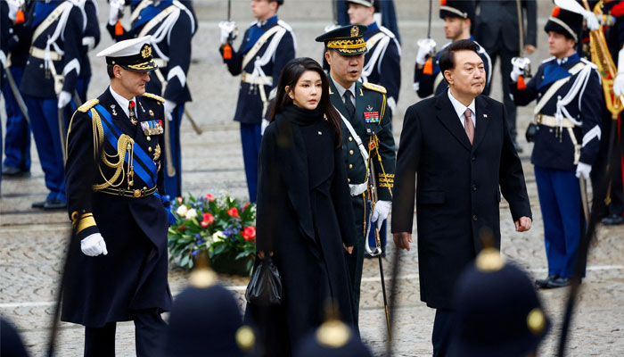 South Koreas President Yoon Suk Yeol and his wife Kim Keon Hee walk during a ceremony in Amsterdam, Netherlands December 12, 2023. —Reuters