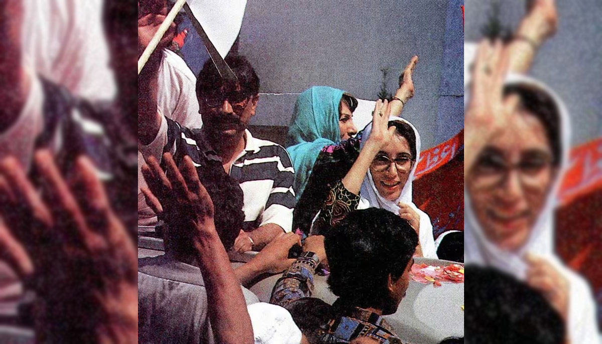 Asif Zardari (left ), dressed in a snazzy black and white striped T-shirt, waves to the crowds alongside Benazir Bhutto in Islamabad in 1993, after she struck a deal with Ishaq Khan. Zardari was made a federal minister. — India Today
