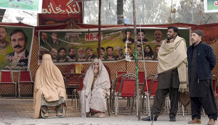 PML-N supporters are seated during an election campaign camp in Islamabad on January 25, 2024. — Online