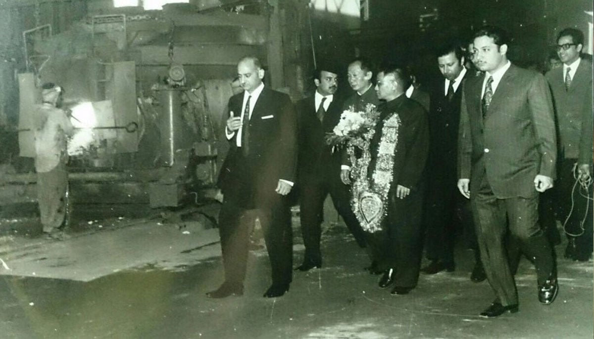 Nawaz Sharif with his brother Shahbaz and father Muhammad Sharif escorting a Chinese delegation.—Agencies